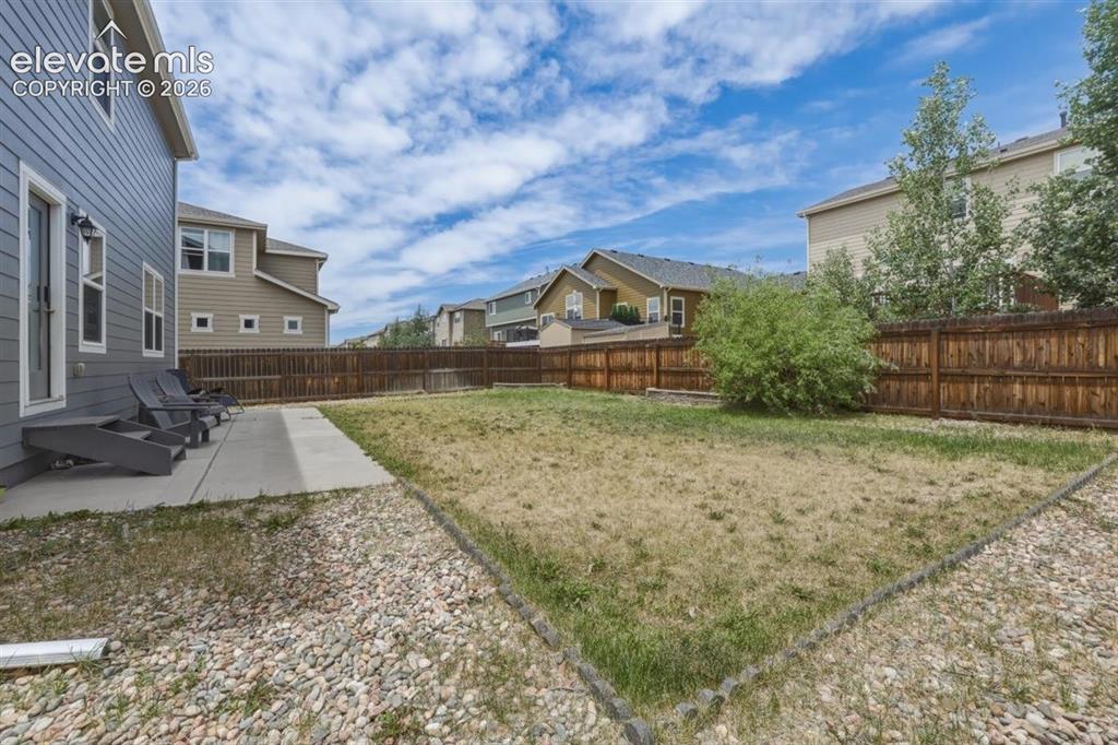 Image 22 of 25: Fully-Fenced Backyard with Automatic Sprinklers