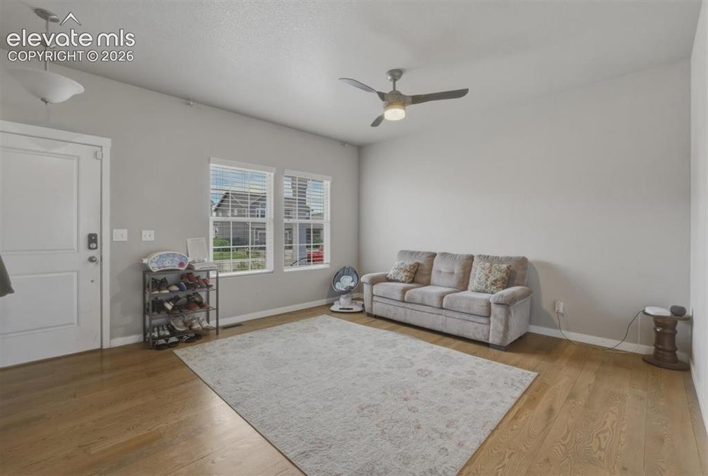 Image 3 of 25: Living Room with Gleaming Wood Floors.