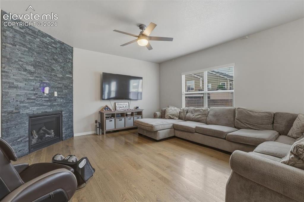 Image 5 of 25: Dramatic Stone Fireplace in Large Family Room