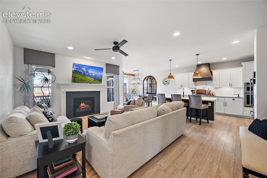Image 6 of 46: Open-concept living space with wood-finish flooring