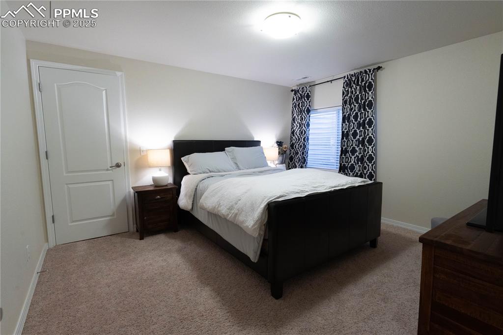 Image 24 of 26: Bedroom featuring carpet flooring and baseboards