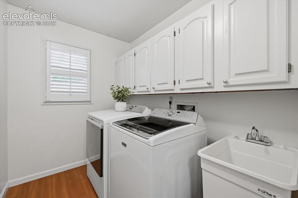 Image 18 of 49: Newly painted cabinets and pull and walls all painted.