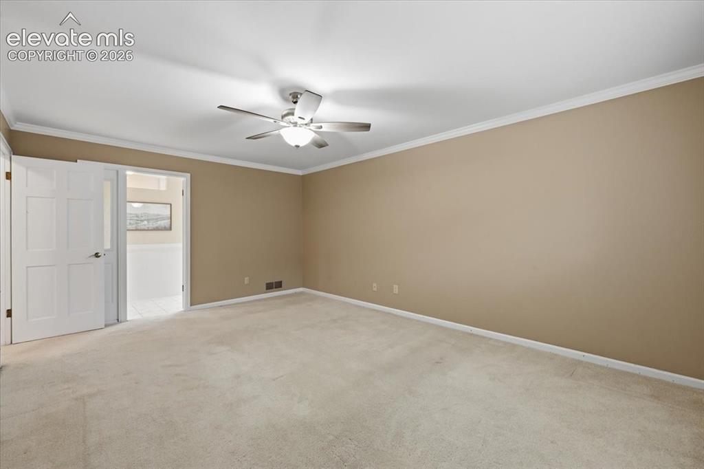 Image 21 of 49: Primary bedroom upper level with huge on-suite bathroom and massive walk in