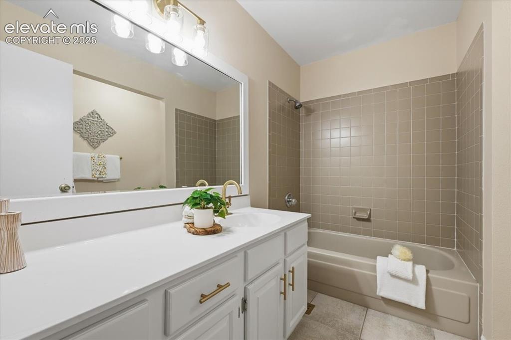Image 27 of 49: upper level bathroom newly painted cabinet and knobs, fixtures, lighting, o