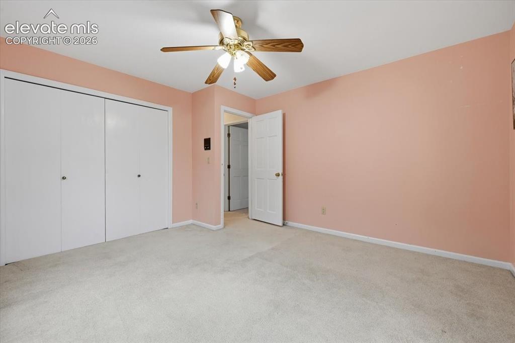 Image 31 of 49: Upper level bedroom on backside of home