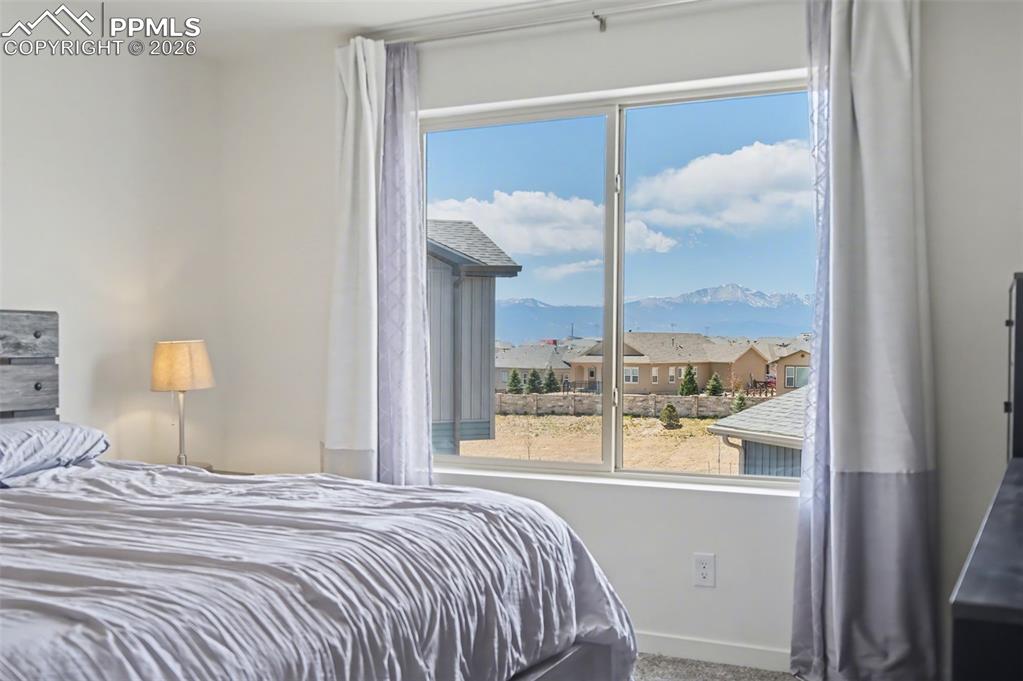Image 14 of 28: View of Pikes Peak from Primary Bedroom