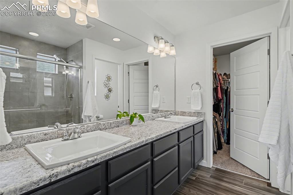 Image 15 of 28: Primary Bathroom with Dual Vanities