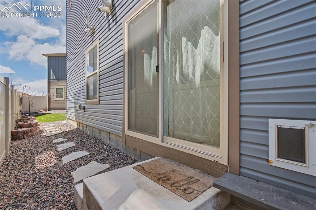Image 24 of 28: Walkout from Family Room to Backyard