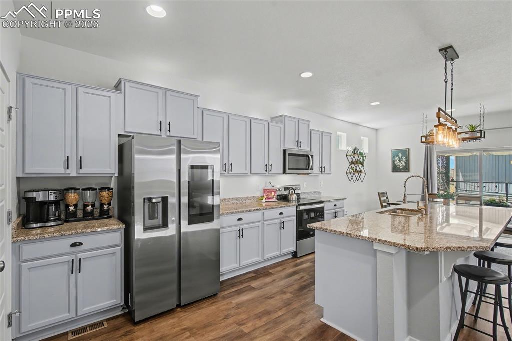 Image 4 of 28: Kitchen with Smart Refrigerator & Granite Island