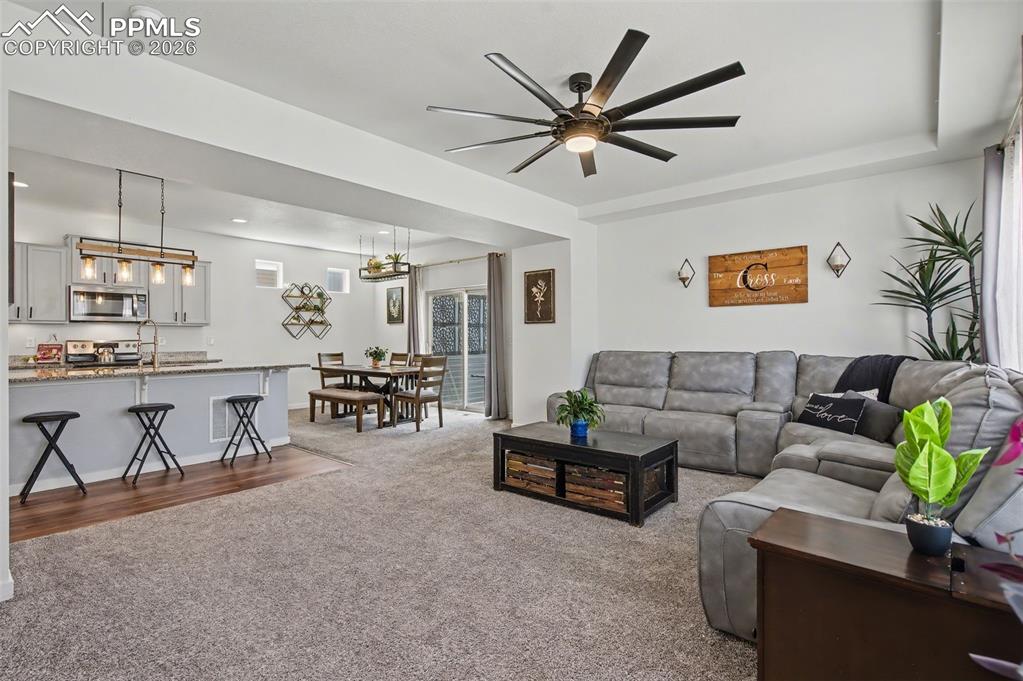 Image 7 of 28: Great Room with View of Kitchen & Dining Room