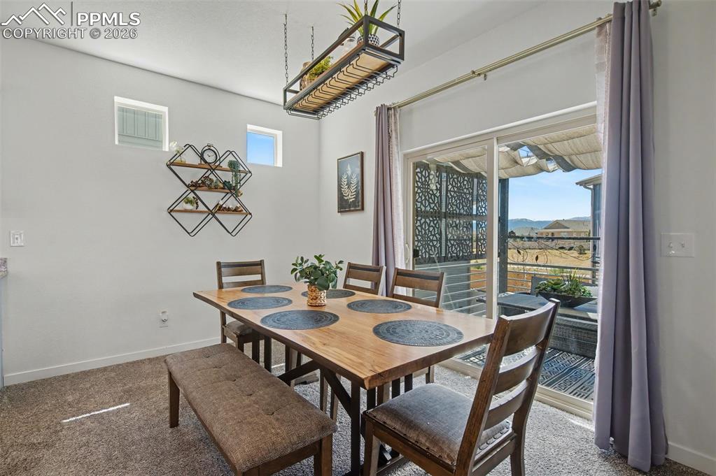 Image 9 of 28: Dining Room with Walk-Out to Deck
