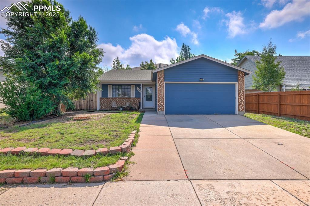 Caption: Front of home with an attached 2 car garage