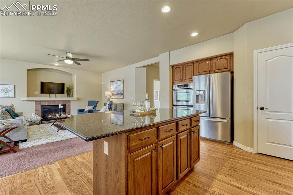 Image 14 of 50: The kitchen offers high-end stainless steel JennAir and Whirlpool appliance