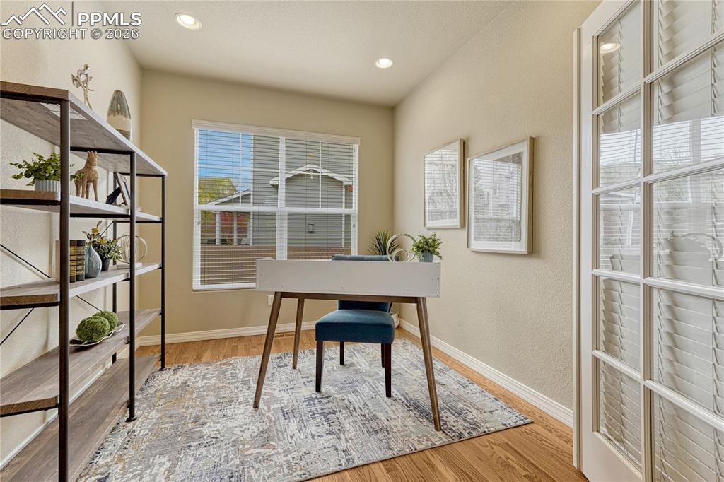 Image 19 of 50: The seamless flow from the kitchen means you can keep an eye on the TV or j