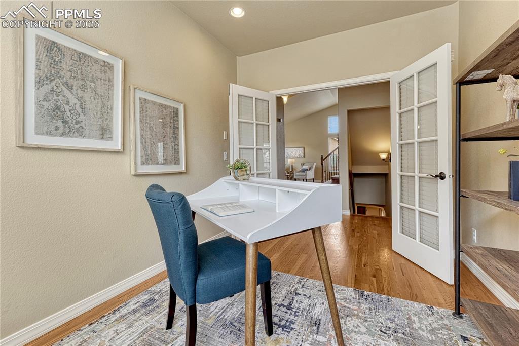 Image 20 of 50: Generous square footage allows for oversized furniture, giving everyone in 