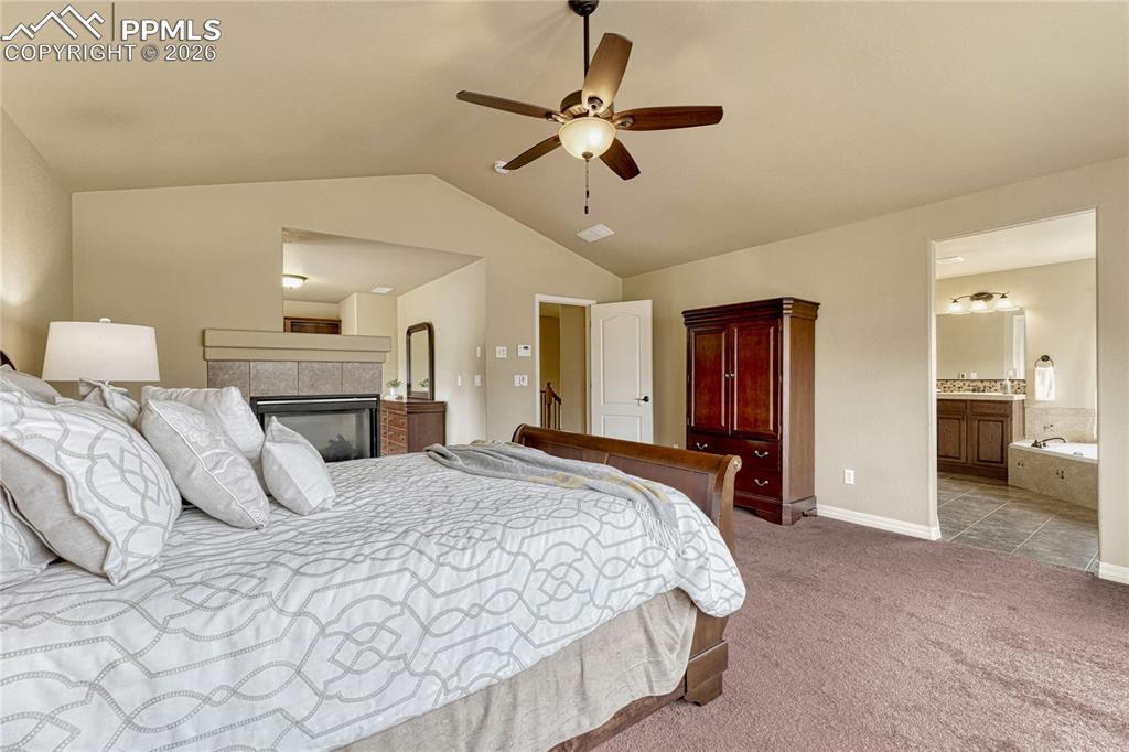 Image 24 of 50: Chores become a breeze in this main-level laundry room equipped with a util