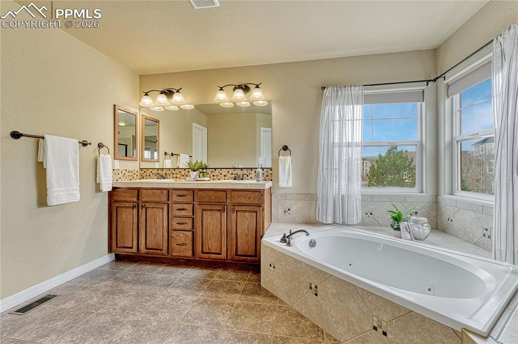 Image 30 of 50: Enjoy the luxury of sprawling out in a primary suite that easily accommodat