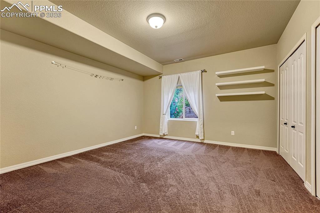 Image 41 of 50: A great basement bedroom is an ideal long-term retreat for family or guests