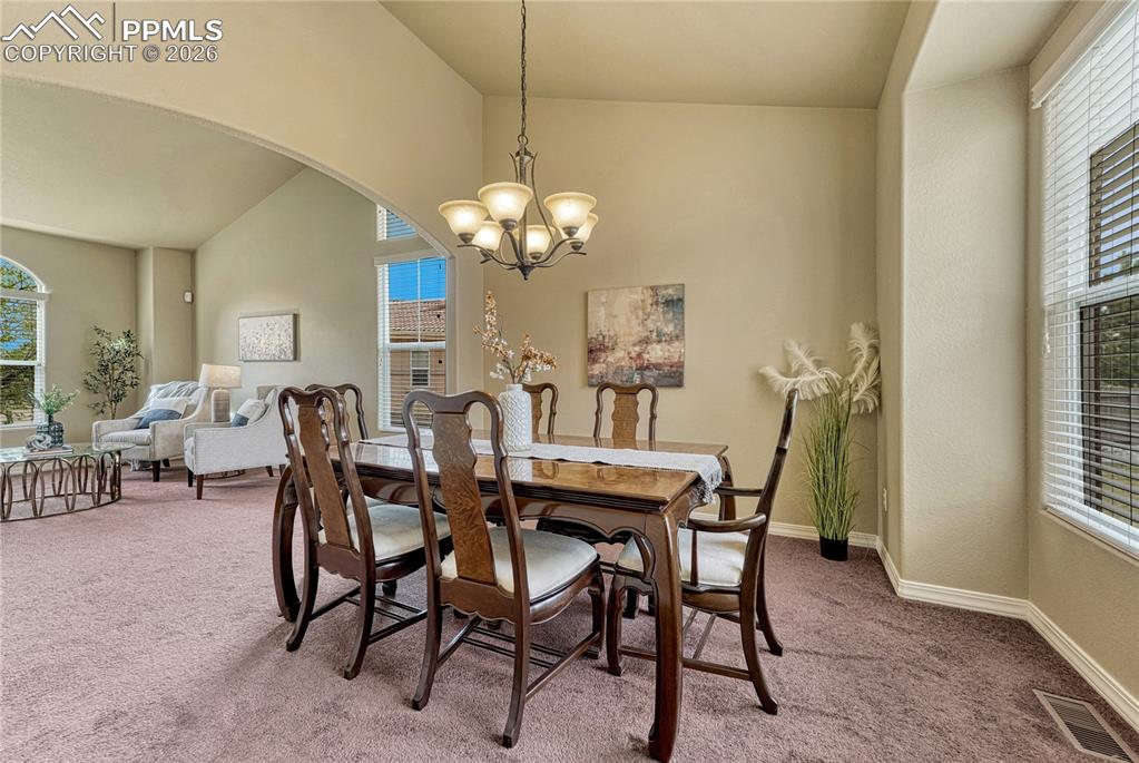 Image 8 of 50: The vaulted ceilings elevate the space, offering an environment for greetin