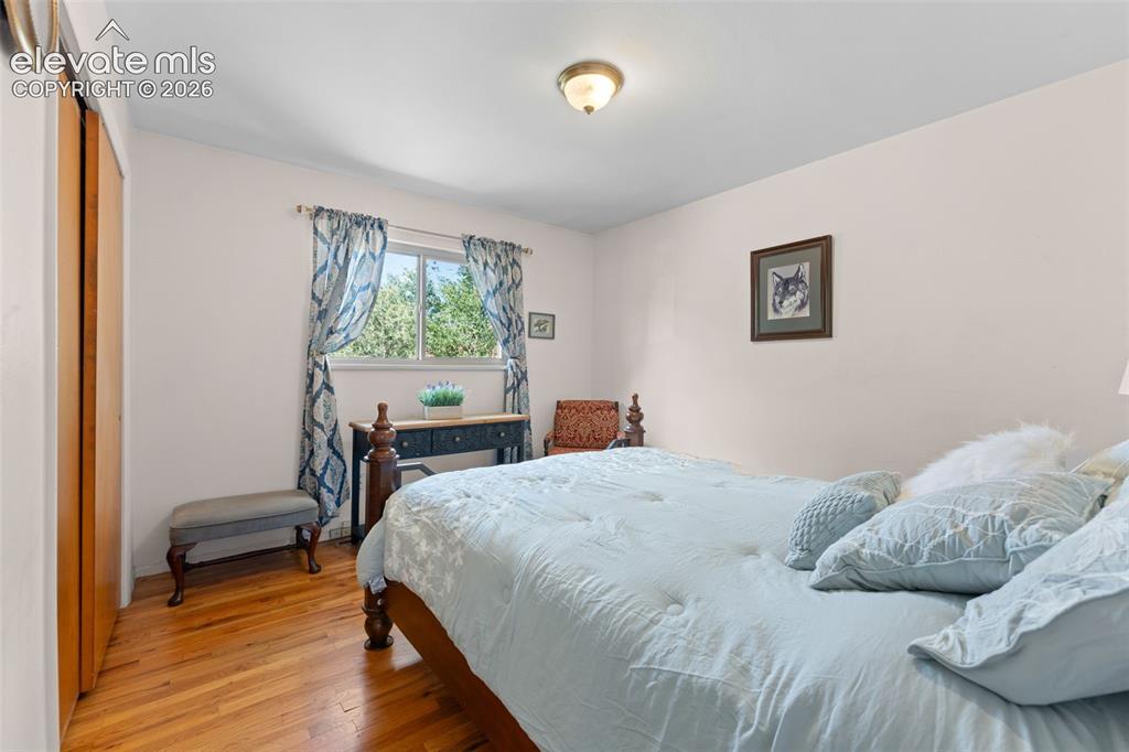 Image 5 of 50: Hardwood flooring, window with natural lighting, built-in closet with bi-fo