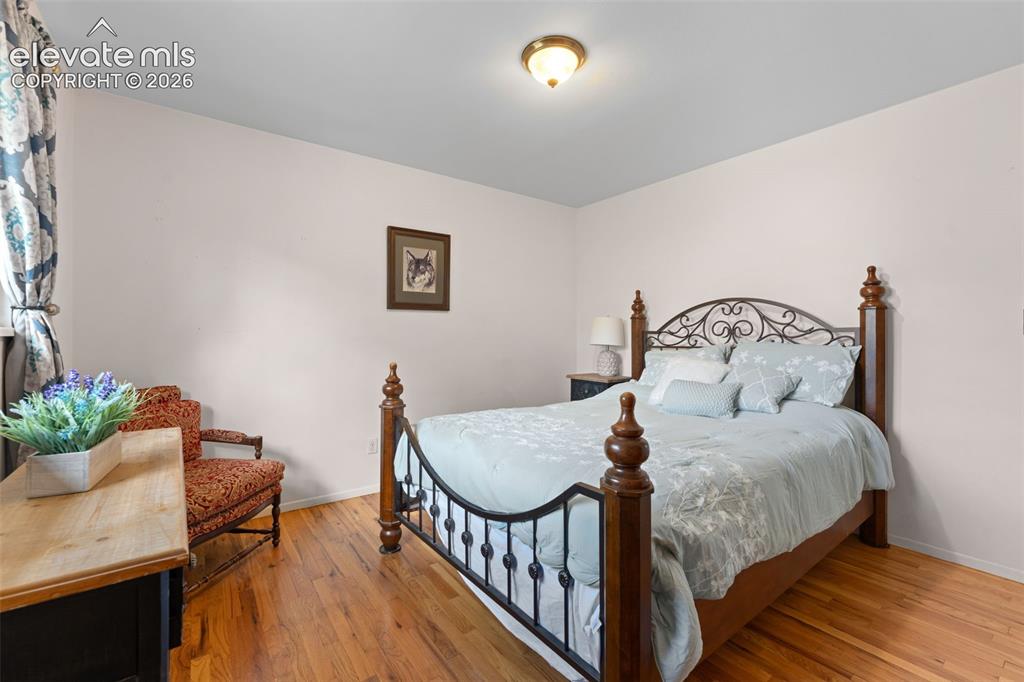 Image 8 of 50: Hardwood flooring, neutral wall tones, semi-flush mount ceiling light