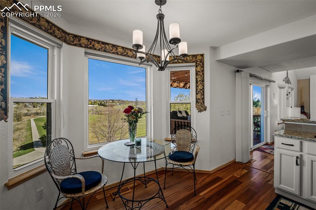 Image 12 of 50: Breakfast area featuring expansive windows with landscape views of Cootonwo