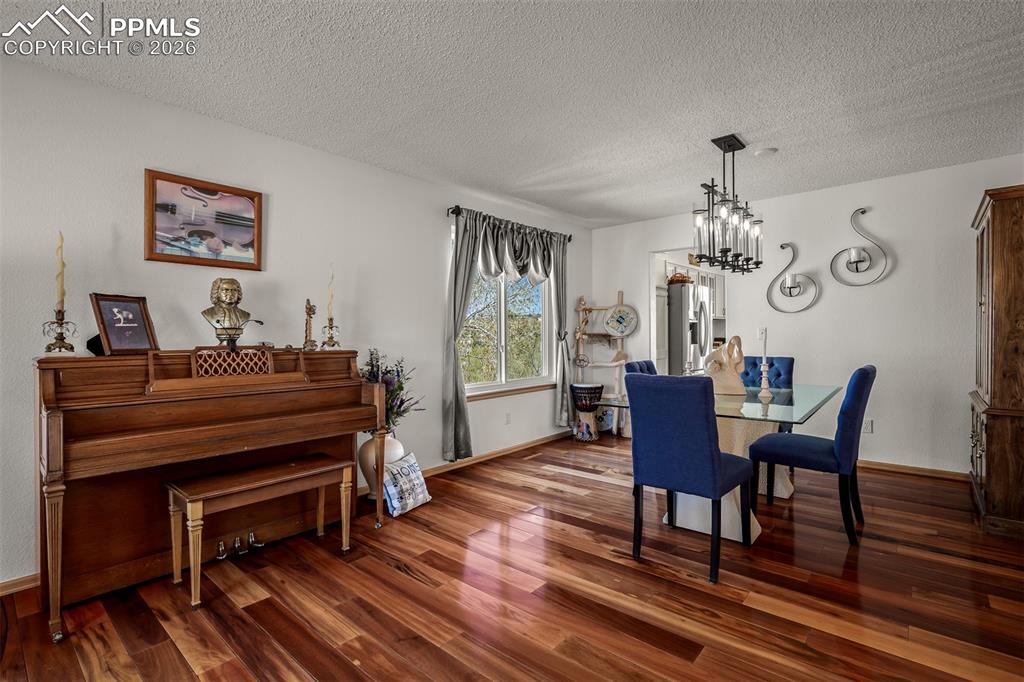 Image 17 of 50: Spacious interior with rich Brazilian Koa Hardwood flooring.