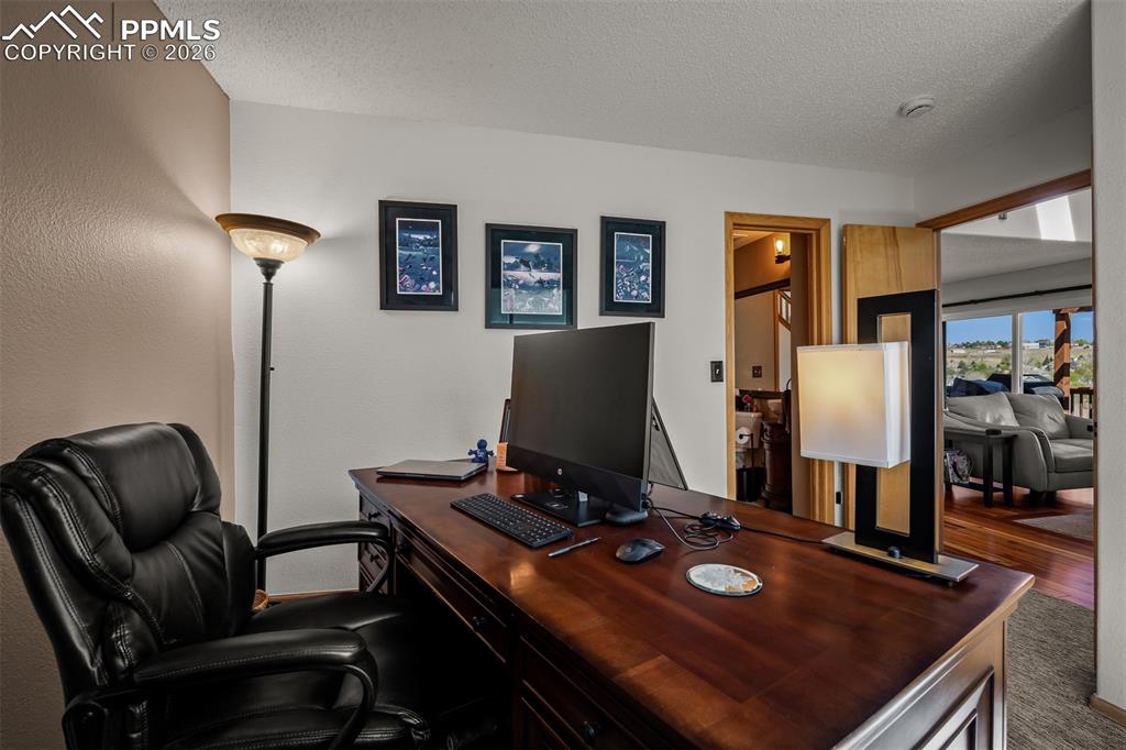 Image 22 of 50: Main floor office or bedroom opening to family room and 3/4 bathroom.