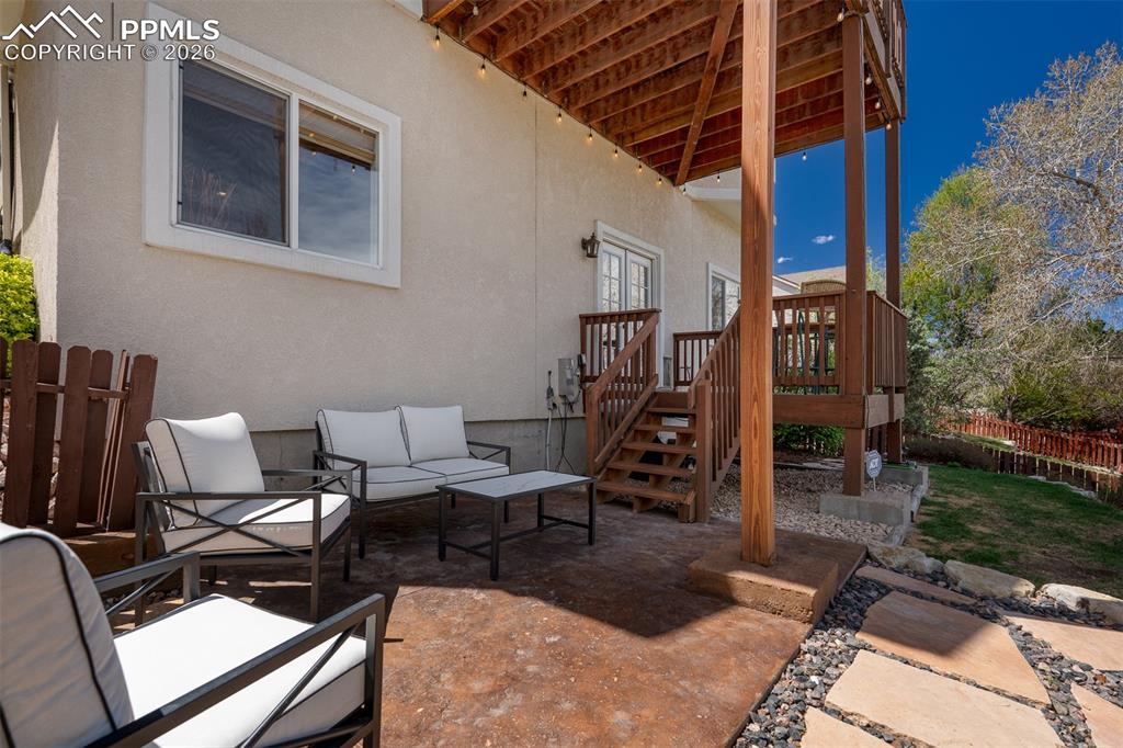 Image 44 of 50: Enjoy summer evenings on the back yard patio overlooking the park.