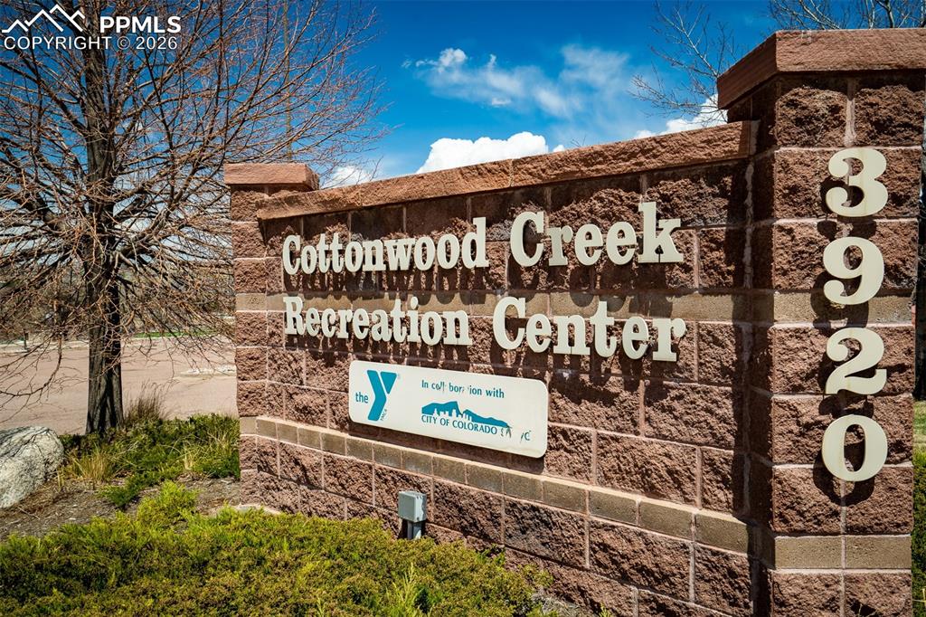 Image 50 of 50: Cottonwood Creek Recreation Center signage featuring a stacked stone facade