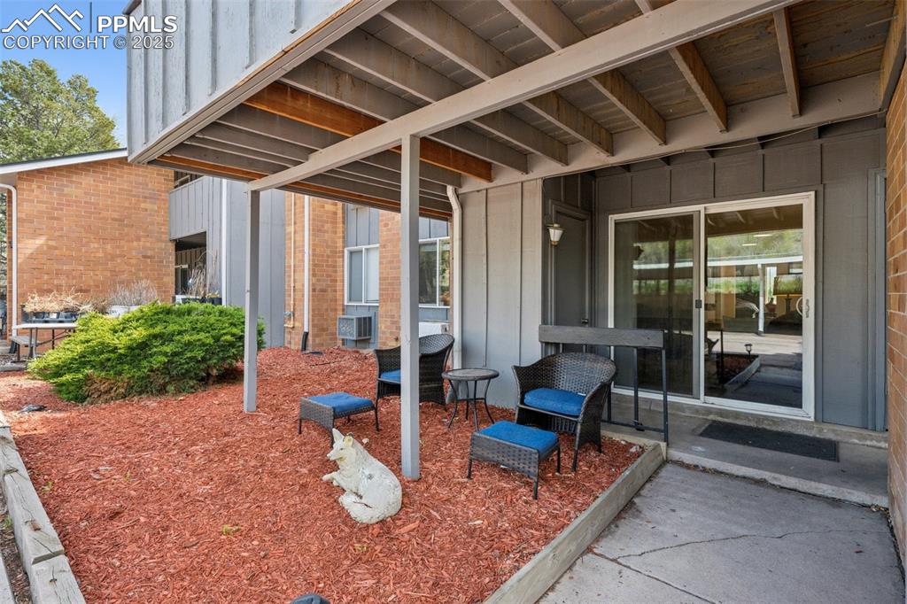 Image 10 of 11: Private covered patio with space to relax or entertain outdoors.