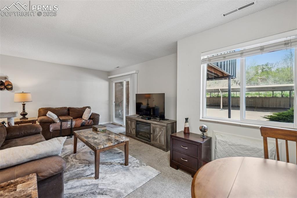 Image 4 of 11: Spacious layout connecting living and dining areas, perfect for everyday co