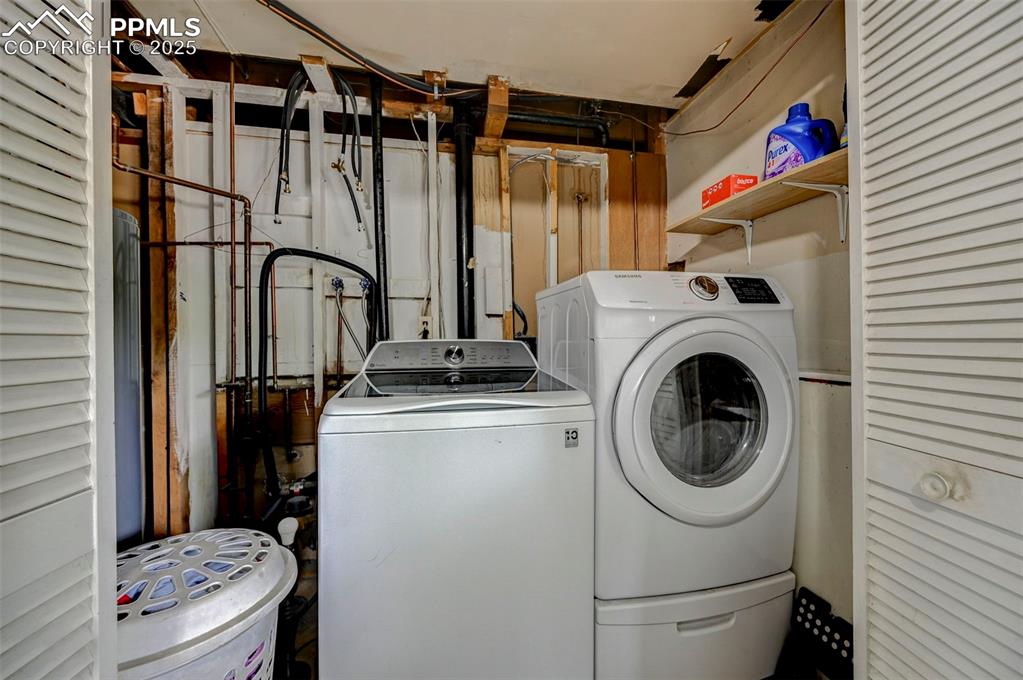 Image 26 of 30: Laundry room located downstairs off family room