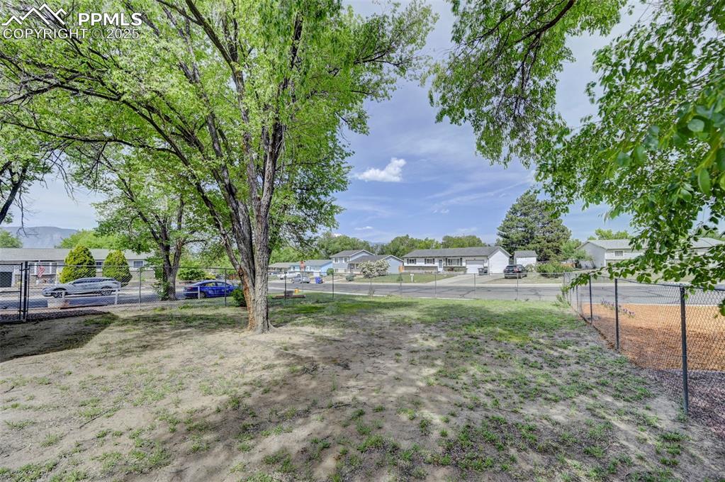 Image 4 of 30: View of yard with a residential view