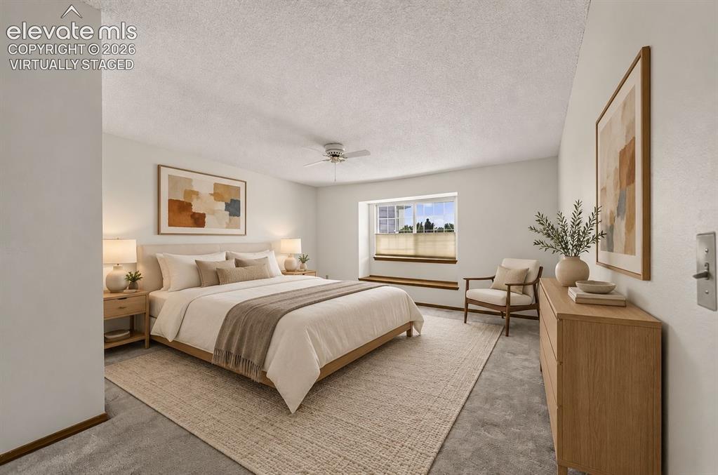Image 22 of 45: Large Master Bedroom w/window seat & en-suite bath. Virtually Staged.
