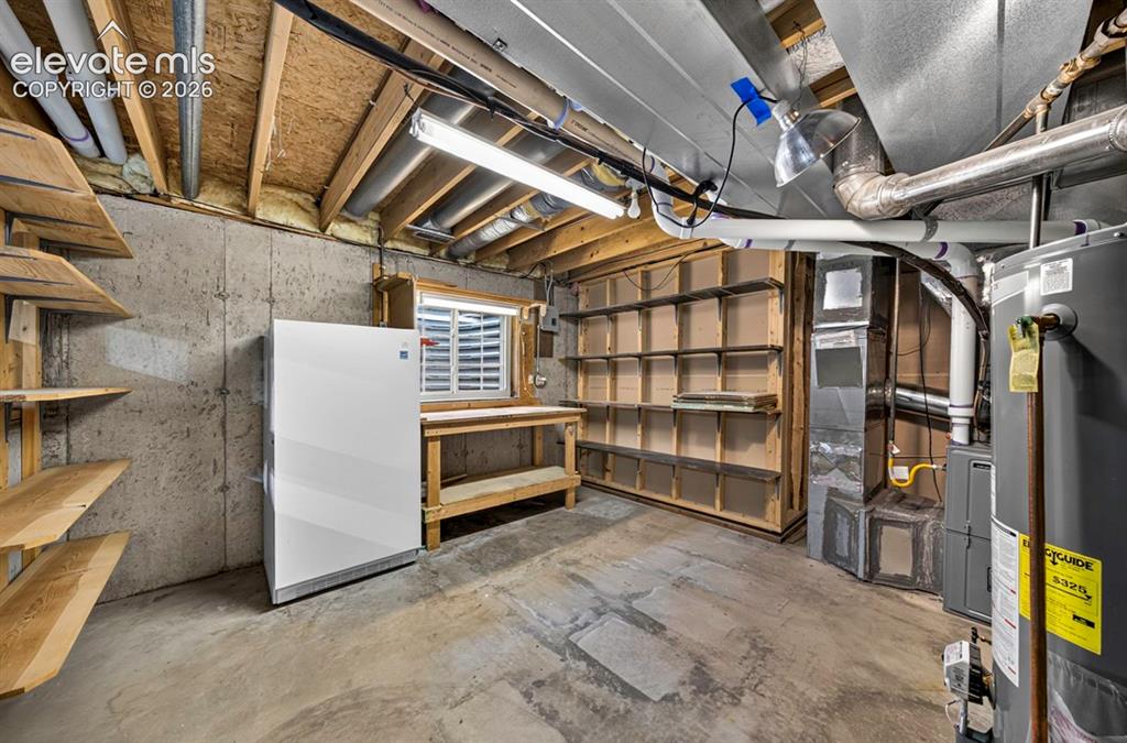 Image 38 of 40: Hobby or Storage with window & Project bench
