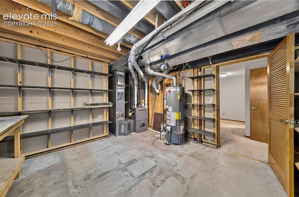 Image 39 of 40: Lots of shelving and storage plus crawlspace storage!