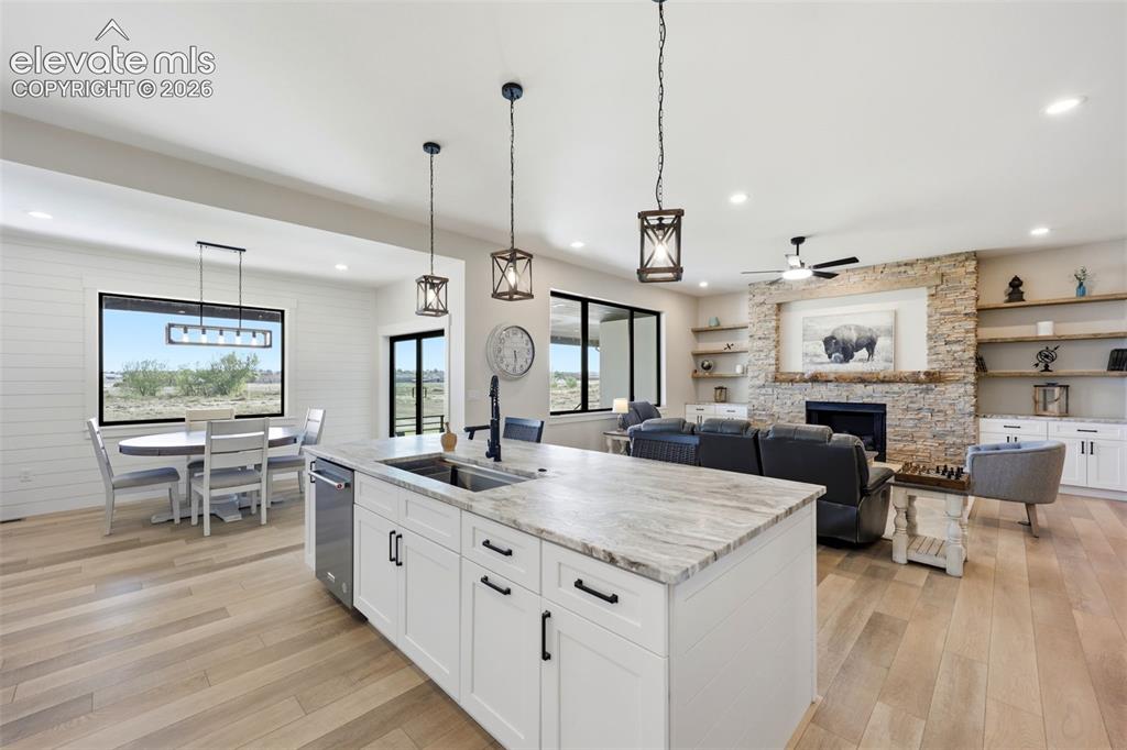 Image 10 of 50: Kitchen looking to living room with adjoining dining room