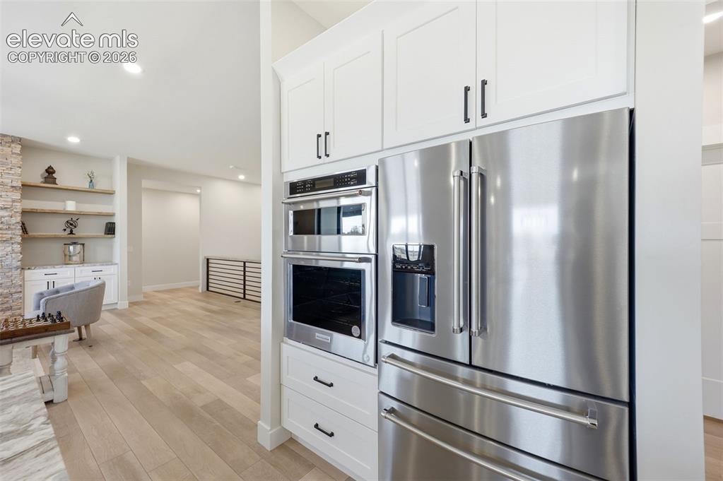 Image 14 of 50: Kitchen oven, microwave and refrigerator
