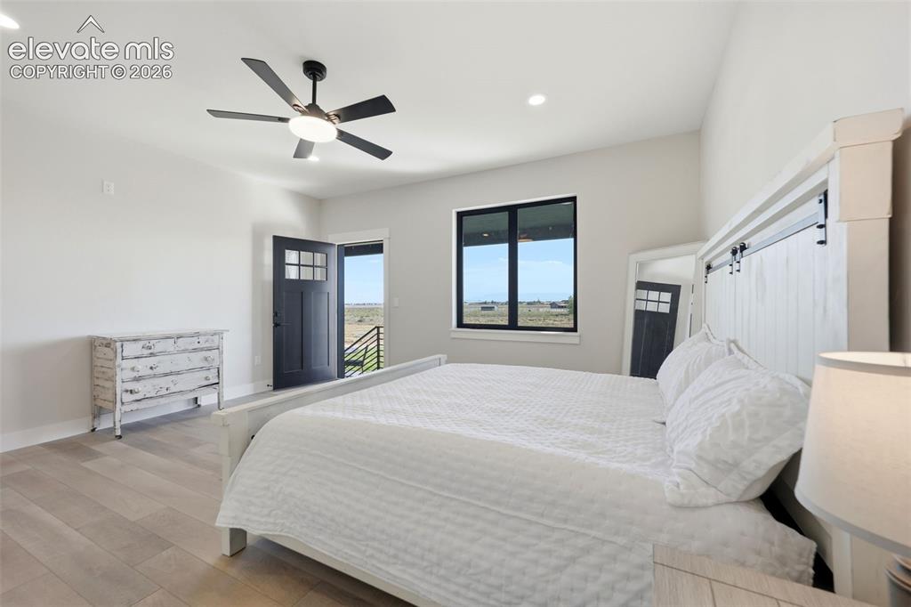 Image 19 of 50: Primary suite with walkout patio access