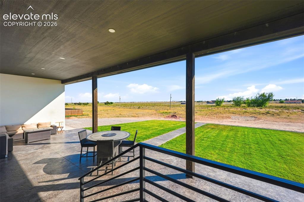 Image 20 of 50: Back patio accessible from Dining room, Primary Suite, walk out basement an