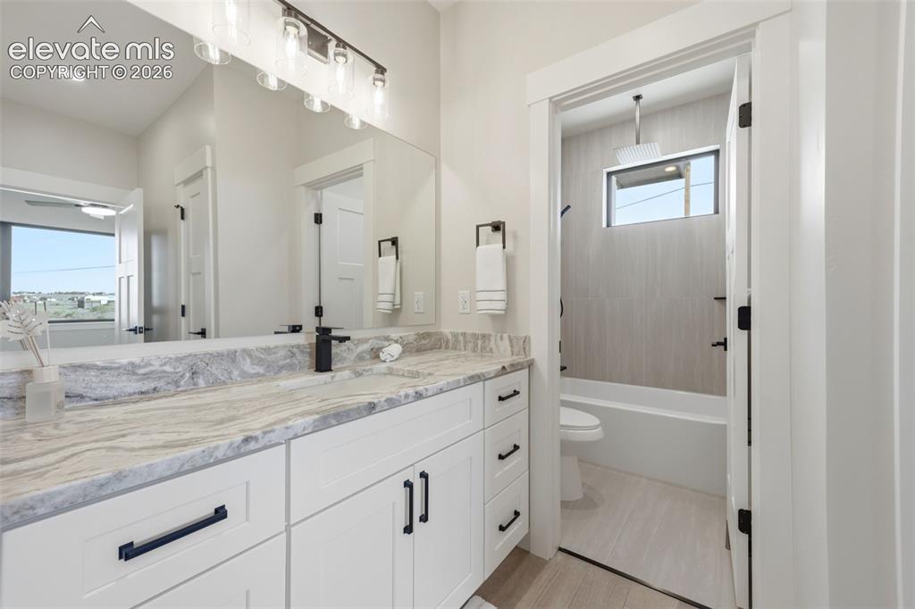 Image 29 of 50: Hall bath and attached full bath to Bedroom $3