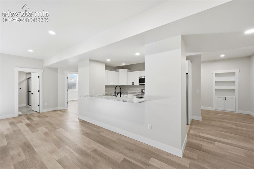 Image 41 of 50: Wet Bar and full kitchen in basement