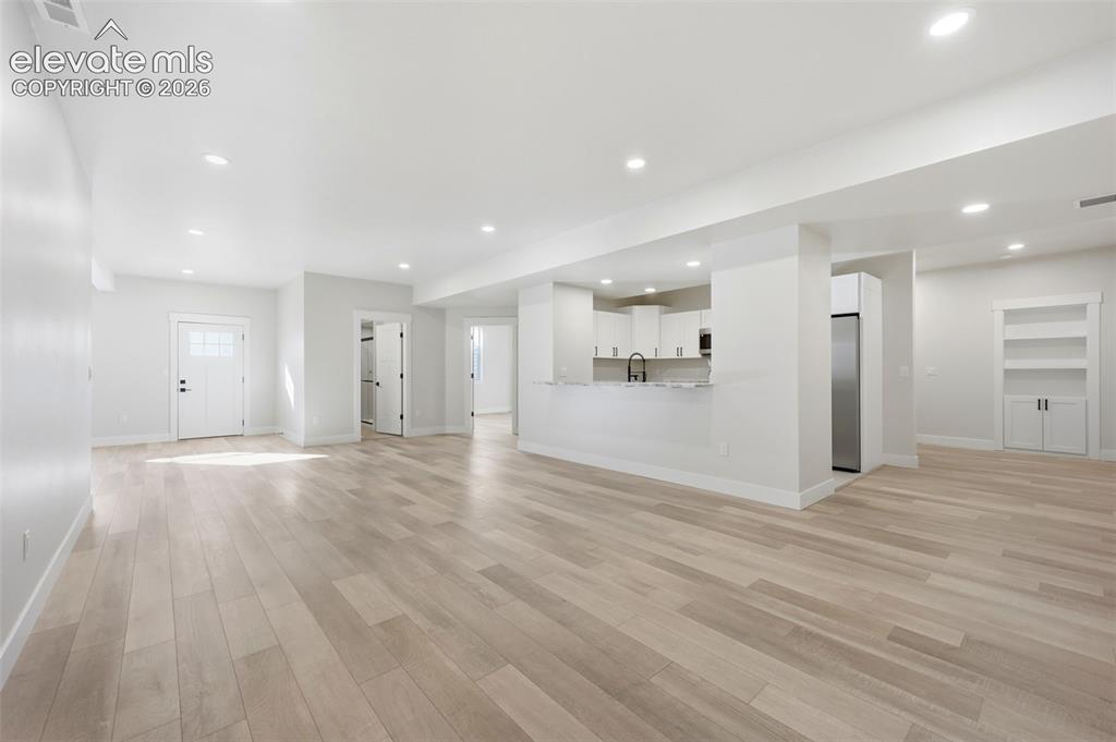 Image 43 of 50: Family room in basement