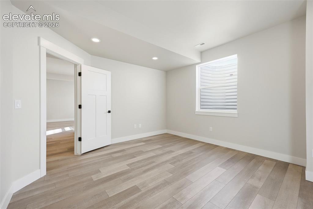 Image 48 of 50: Basement bedroom #5 with walk in closet