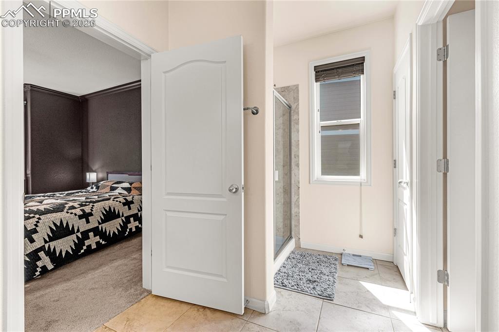 Image 19 of 37: master bath showing walk in shower