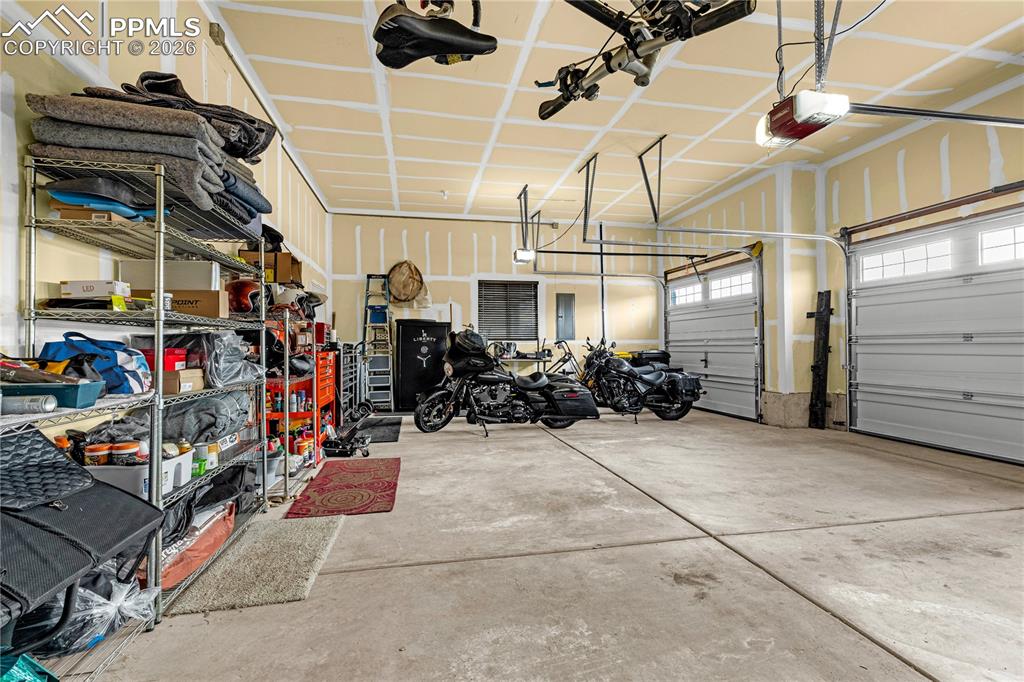Image 31 of 37: Garage with a garage door opener