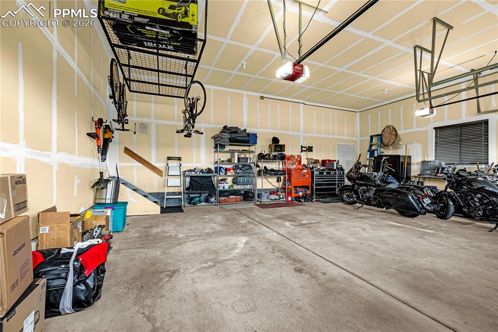 Image 32 of 37: Garage with a garage door opener