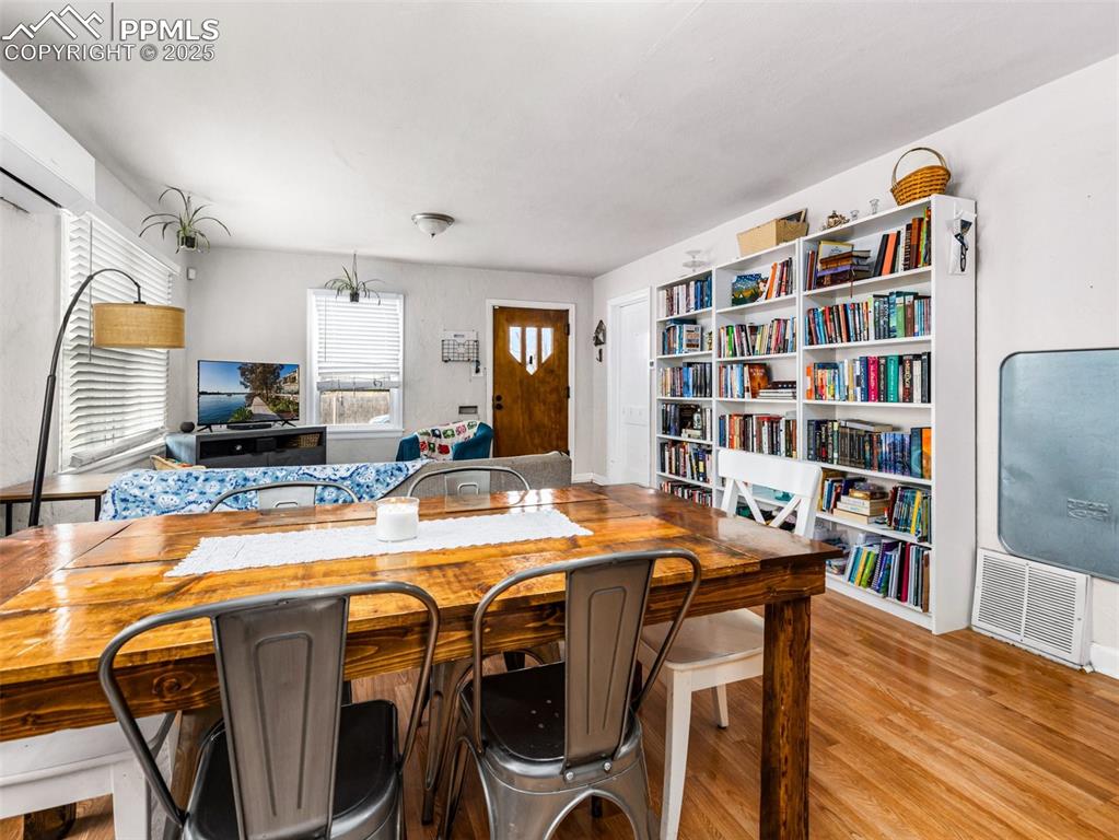 Image 10 of 33: Kitchen with light wood-type flooring