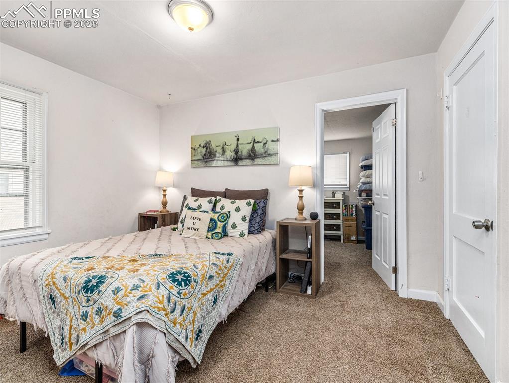 Image 20 of 33: Carpeted bedroom featuring baseboards